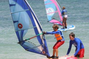 kid learning to windsurf
