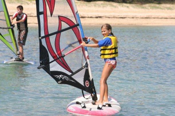 kid windsurfing